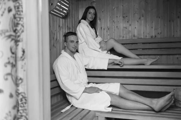 Couple relaxing in the sauna — Stock Photo, Image