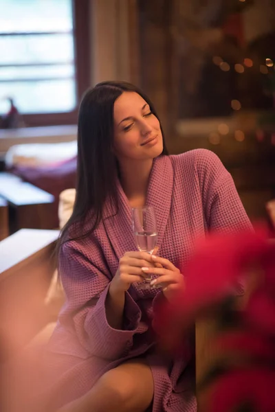 Woman drinking champagne at spa — Stock Photo, Image