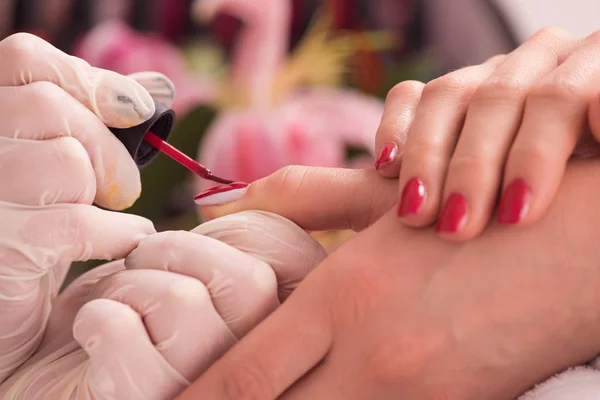 Woman hands receiving a manicure — Stock Photo, Image