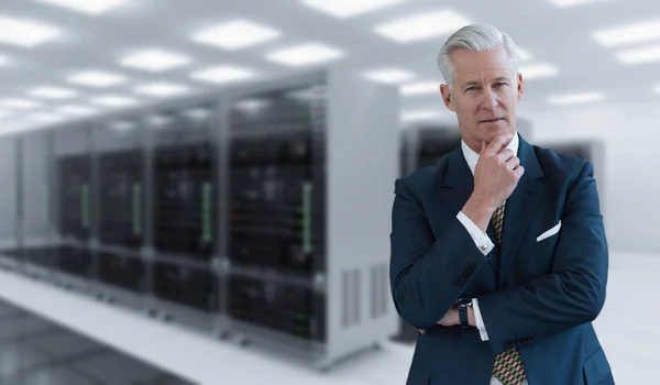 Senior businessman in server room — Stock Photo, Image