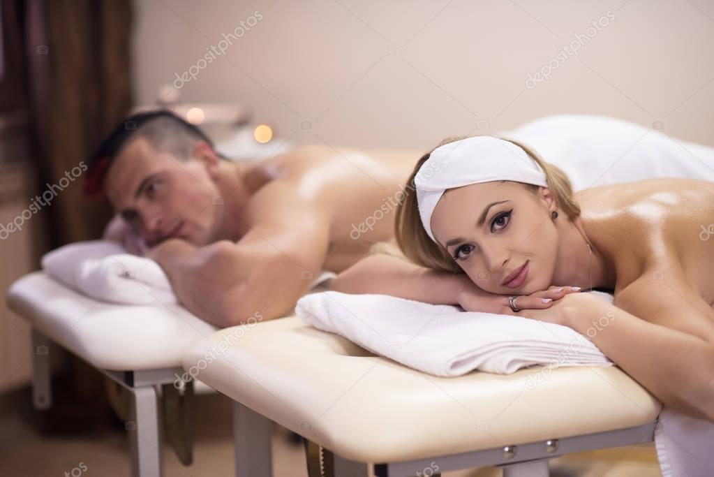 young couple lying on massage table