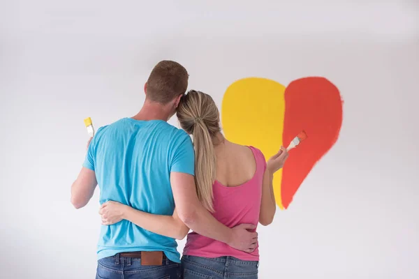 Par målning hjärtat på vägg — Stockfoto