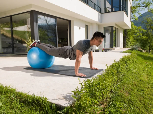 Man doing morning yoga exercises — Stock Photo, Image