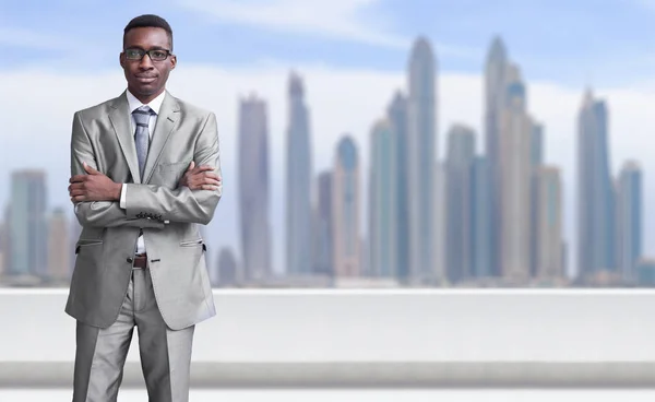 Young black businessman in front of the big city — Stock Photo, Image