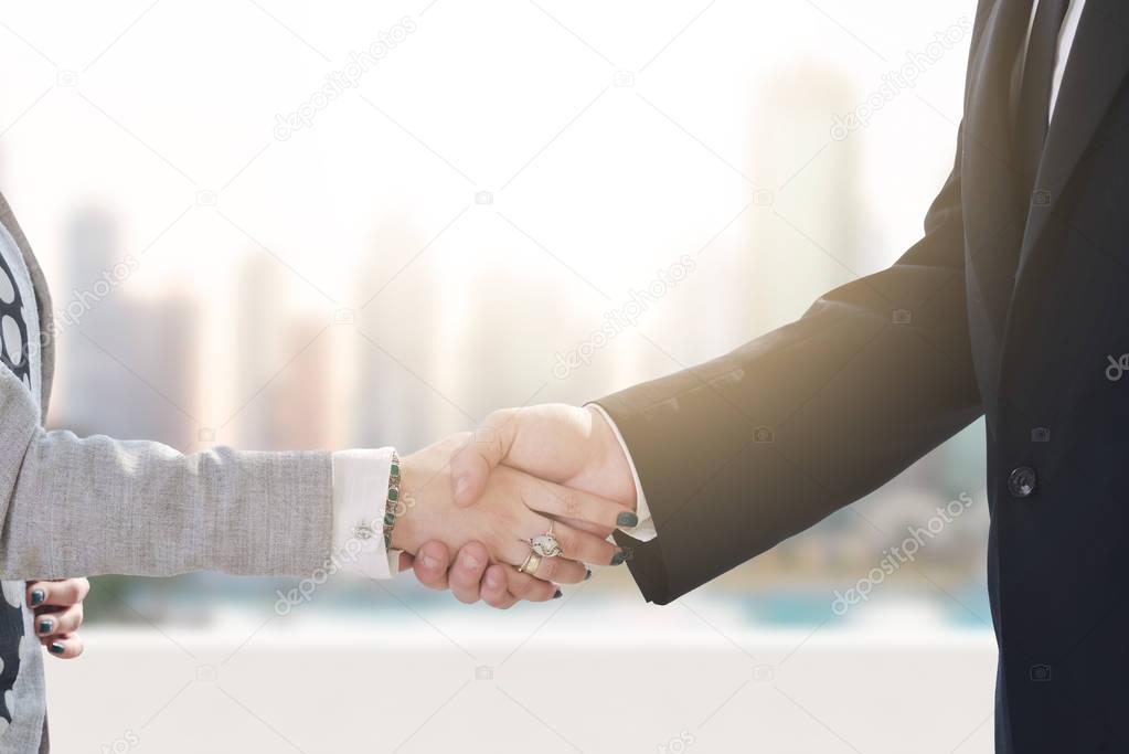 business man and woman handshake on  meeting