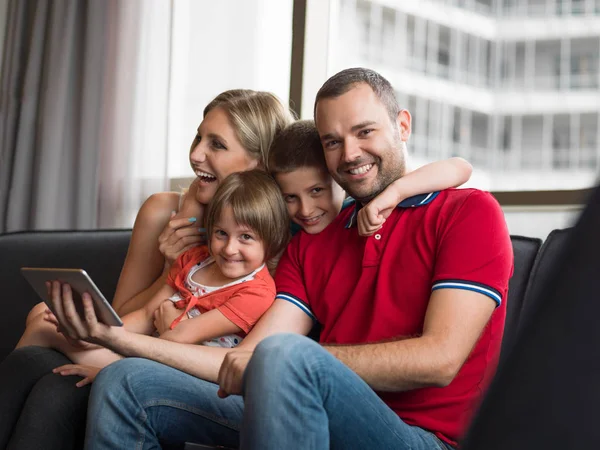 Young cuple spending time with kids — Stock Photo, Image