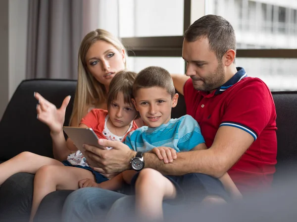 Young cuple spending time with kids — Stock Photo, Image