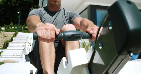 Man Working Out Row Machine Front Home — Stock Photo, Image