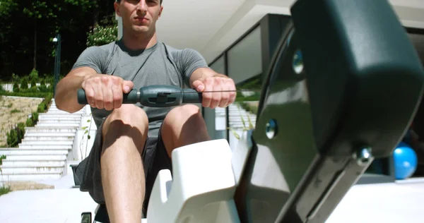 Man Working Out Row Machine Front Home — Stock Photo, Image