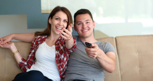Young Couple Watching Tv at villa