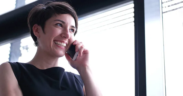 Businesswoman Speaking Phone Window Modern Office — Stock Photo, Image