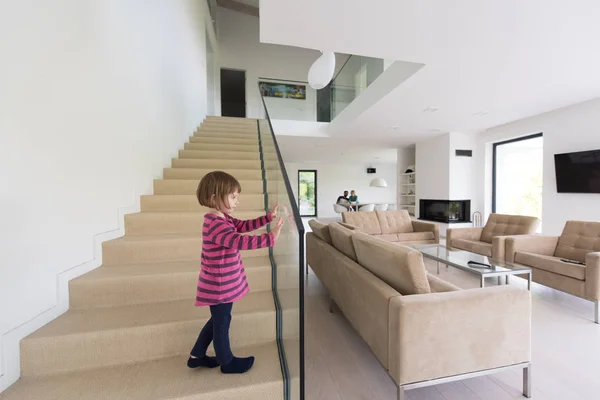 Family with little girl enjoys in the modern living room — Stock Photo, Image