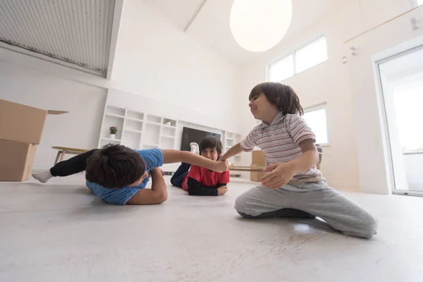 Boys having fun on the floor — стоковое фото