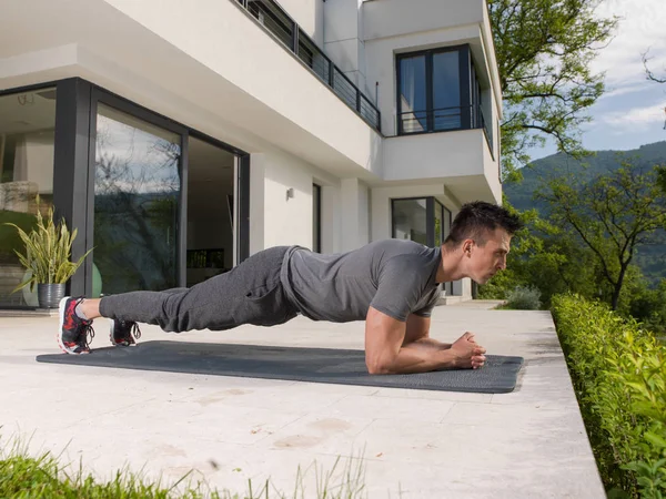 Man doing morning yoga exercises — Stock Photo, Image