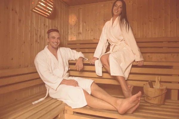 Couple relaxing in the sauna — Stock Photo, Image