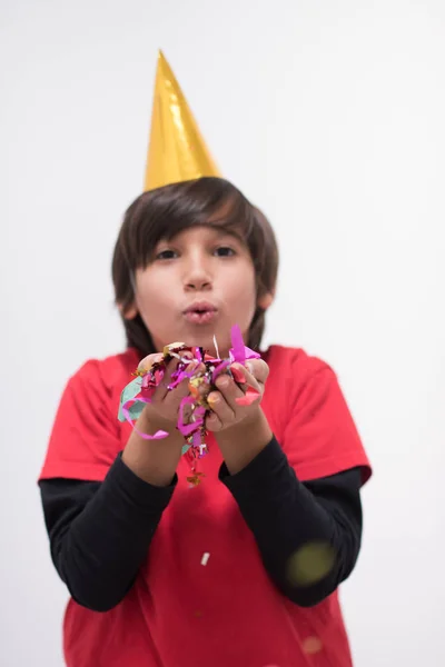 Niño soplando confeti —  Fotos de Stock