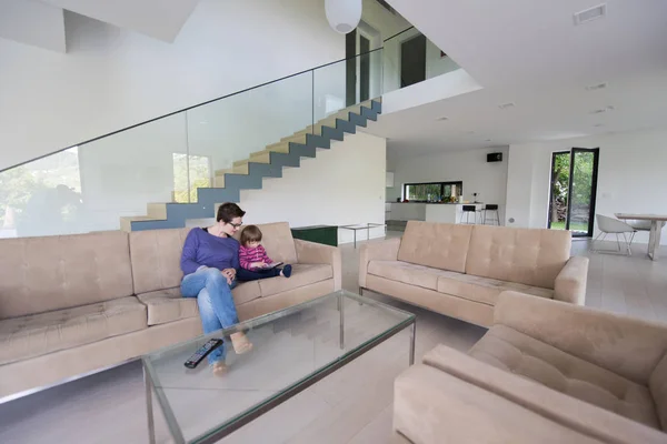 Mother and her cute little daughter are using a tablet — Stock Photo, Image