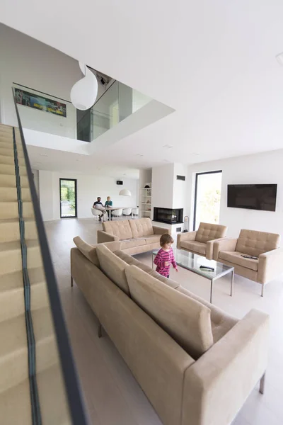 Family with little girl enjoys in the modern living room — Stock Photo, Image