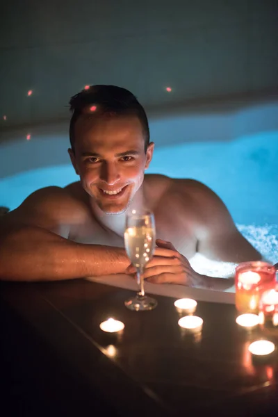 Man relaxing in the jacuzzi — Stock Photo, Image