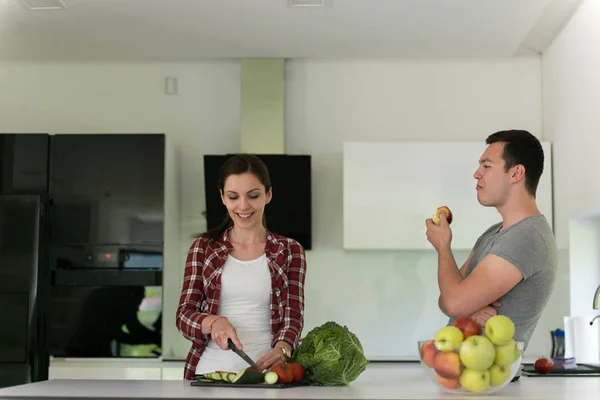 Young handsome couple in the kitchen — Stock Photo, Image