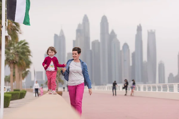 Mother and cute little girl on the promenade — Stock Photo, Image