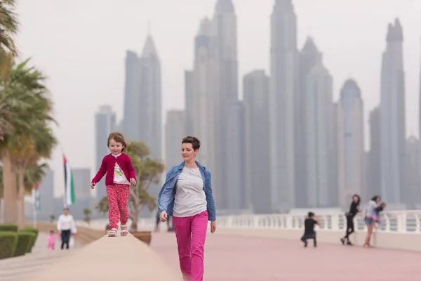 Mother and cute little girl on the promenade — Stock Photo, Image