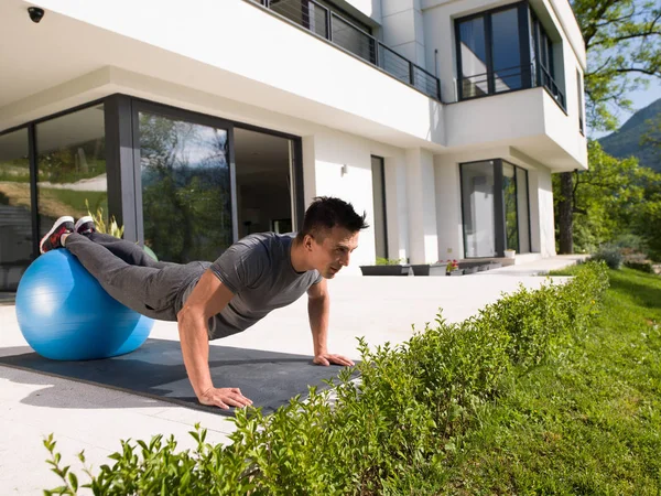 Man doing morning yoga exercises — Stock Photo, Image