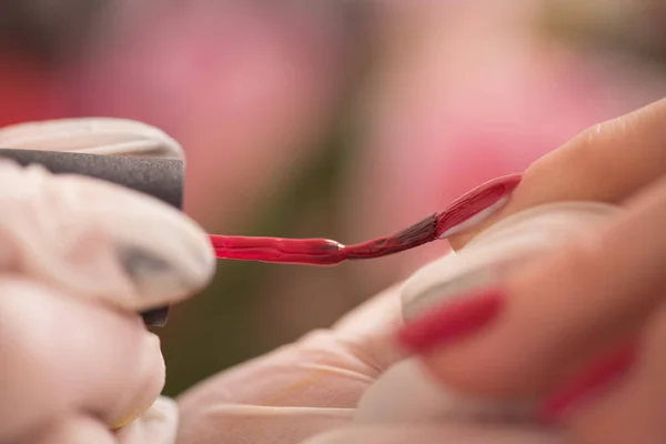 Woman hands receiving a manicure — Stock Photo, Image