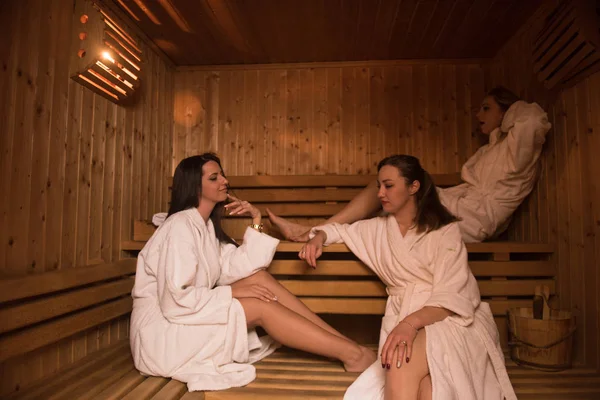 A group of young women in a sauna — Stock Photo, Image