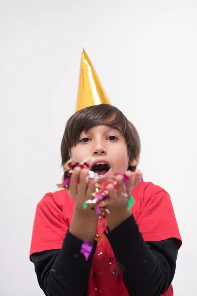 Kid blowing confetti — Stock Photo, Image