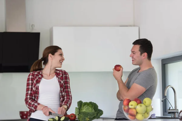 Young handsome couple in the kitchen — Stock Photo, Image