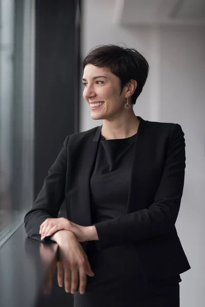 Successful Businesswoman by the window — Stock Photo, Image