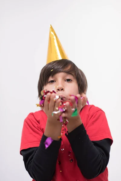 Kid blåser konfetti — Stockfoto