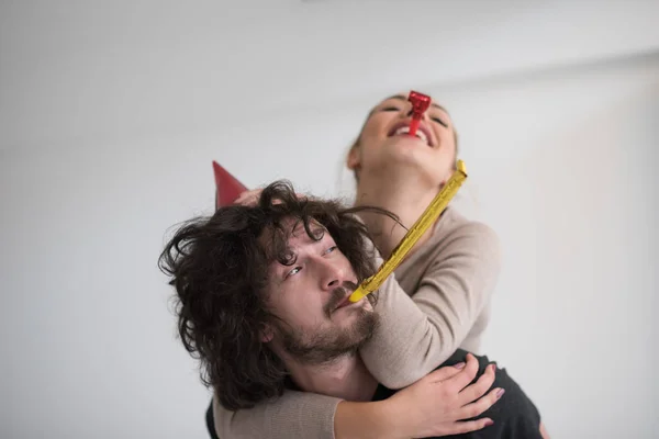 Couple blowing in whistles — Stock Photo, Image