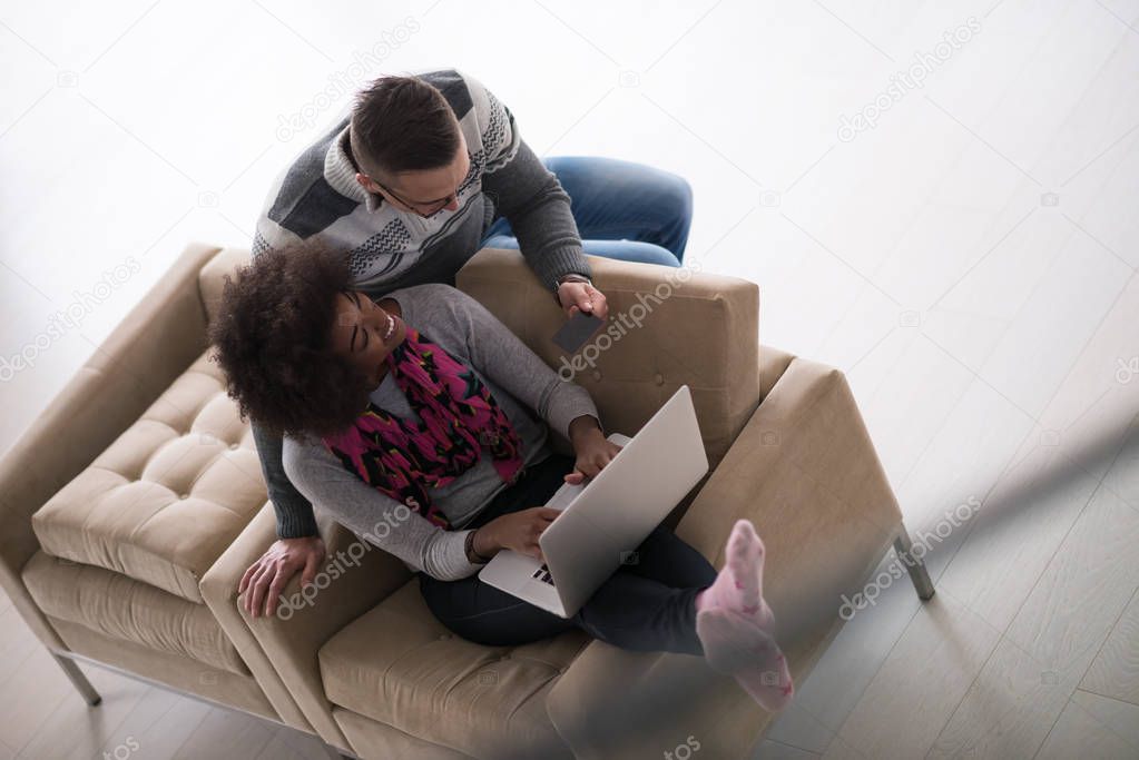 multiethnic couple shopping online