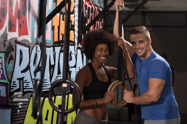 Portrait of multi ethnic couple  after workout at gym — Stock Photo, Image