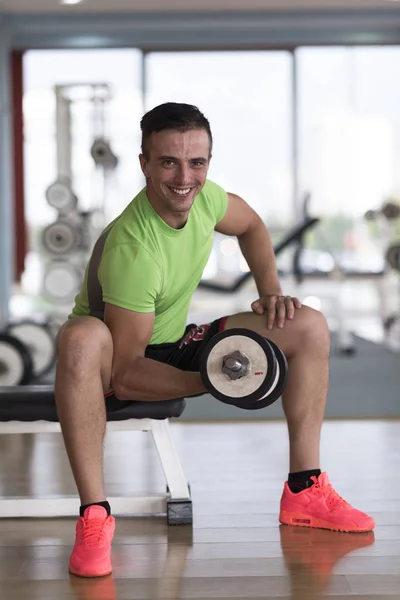Handsome man working out with dumbbell — Stock Photo, Image