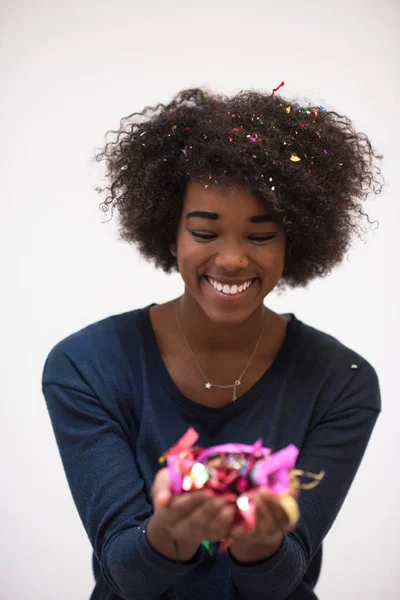 African American woman blowing confetti in the air — Stock Photo, Image