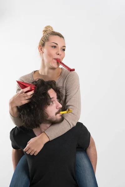 Couple blowing in whistles — Stock Photo, Image