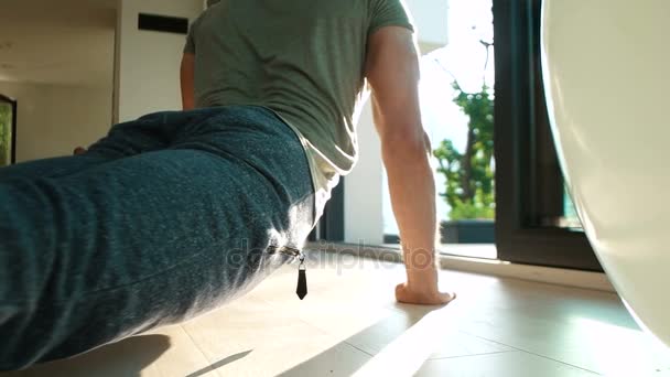 Young Man Stretching, Exercising In Home — Stock Video