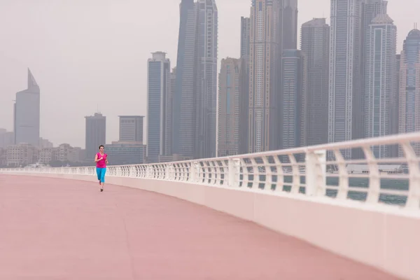 Woman running on the promenade — Stock Photo, Image