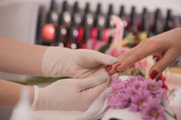 Woman hands receiving a manicure — Stock Photo, Image