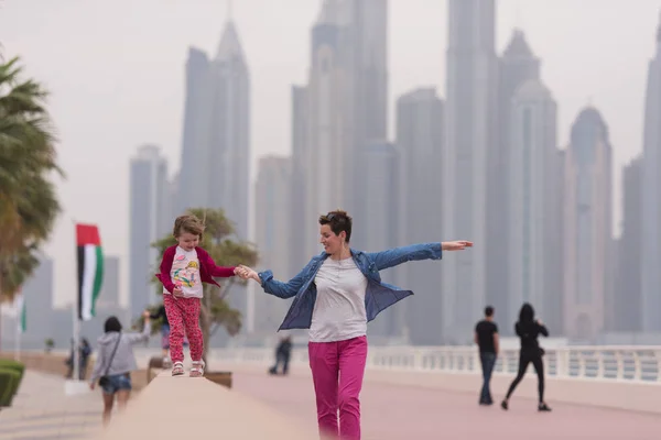 Mother and cute little girl on the promenade — Stock Photo, Image