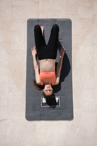Woman doing morning yoga exercises top view — Stock Photo, Image