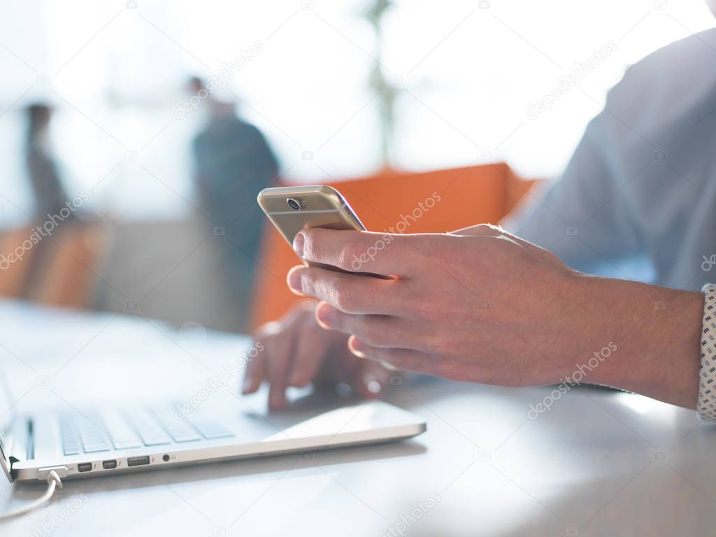 Young man holding smartphone