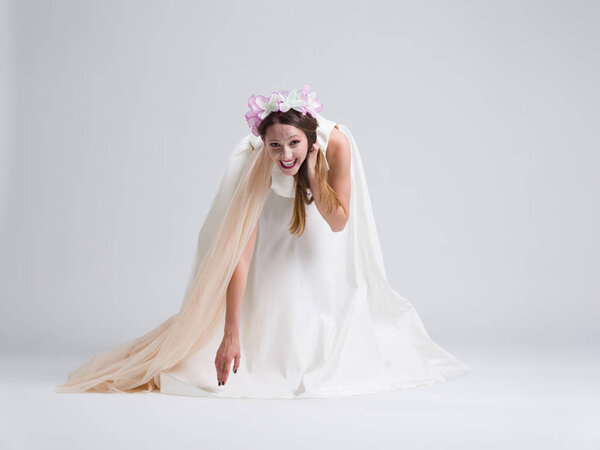 young bride in a wedding dress with a veil