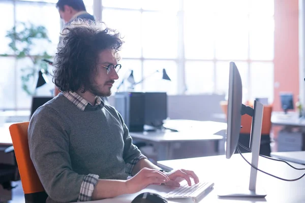 Businessman working using a computer in startup office — Stock Photo, Image