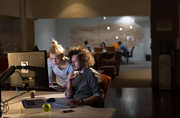 Young designers in the night office — Stock Photo, Image