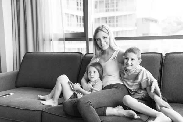 Young mother spending time with kids — Stock Photo, Image