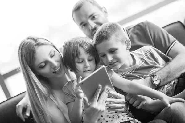 Happy young couple spending time with kids — Stock Photo, Image